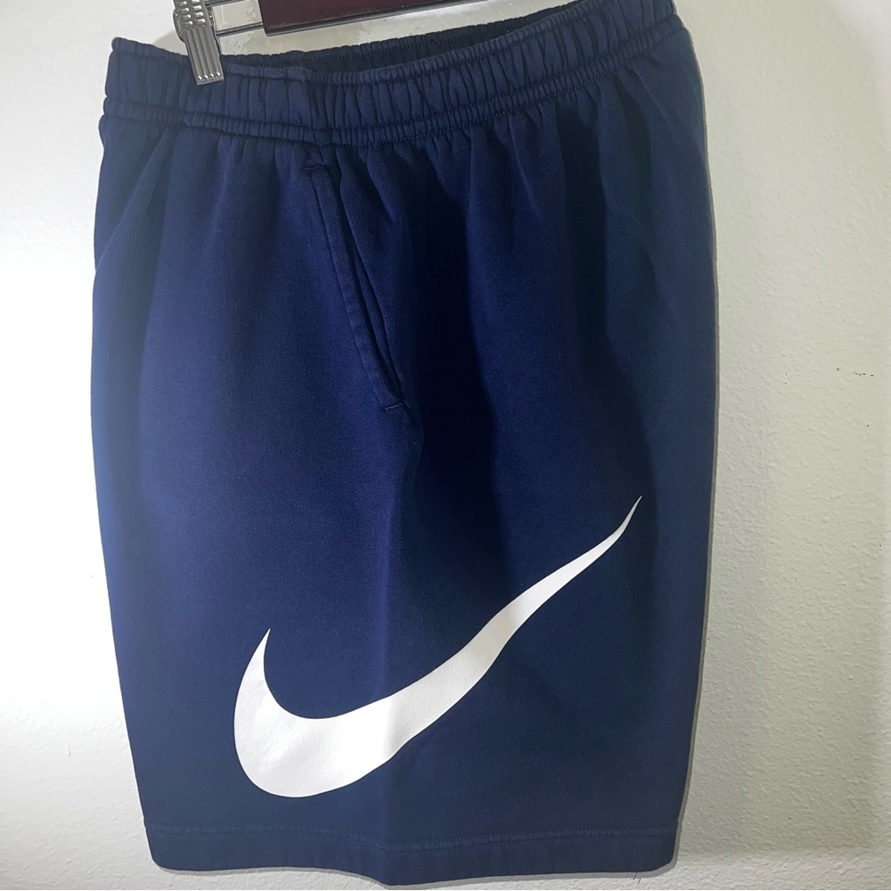Nike sweat shorts with large swoosh on left side. Navy blue.